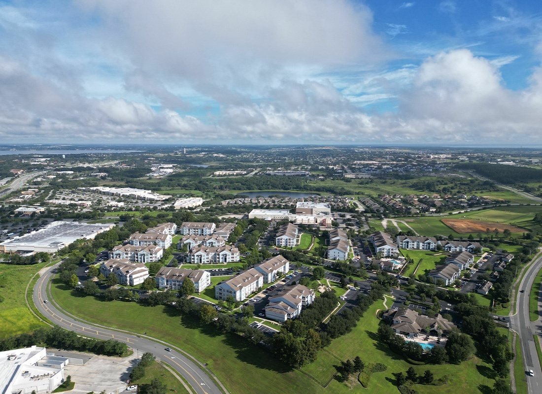 Clermont, FL - Aerial View of Upscale Community and Surrounding Homes in Clermont, Florida on a Sunny Day